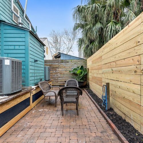 Private outdoor space tucked between fences — your own quiet escape.