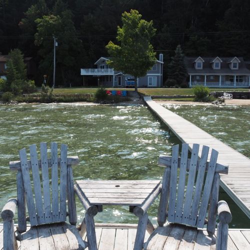 Overall:  the chairs and table that are at the end of the dock.