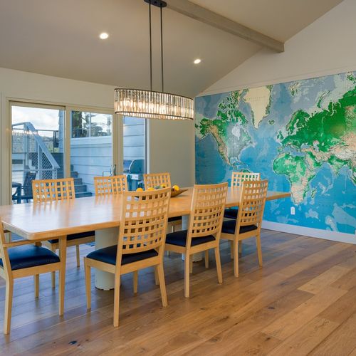 Custom-built dining table with seating for eight to ten guests.