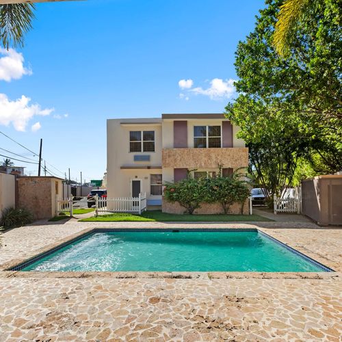 A tranquil haven for relaxation or social gatherings under the sunlit sky.