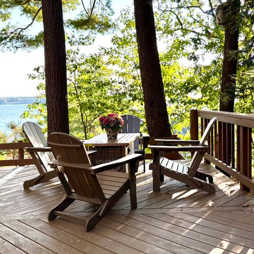 EXTERIOR:  Another view of the fire table with Crystal Lake in the background