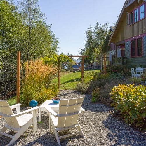 A peaceful garden patio with cozy seating—perfect for morning coffee.