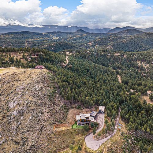 Aerial view of the bailey lodge showcasing its grandeur and stunning natural surroundings.