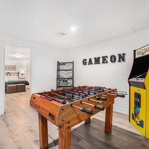 - challenge friends to foosball or beat high scores on the classic pac man arcade
- bold “game on” sign sets the tone for nonstop entertainment
- sleek modern space connects to cozy bedroom for post-game relaxation