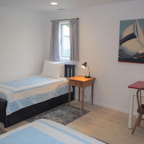 Lower level:   the large lower level basically functions as a third bedroom with 4 single beds via 2 trundle beds (i. E. 2 of the single beds roll up under the other 2 single beds). There is also a desk, two closets, two dressers, and third bathroom.