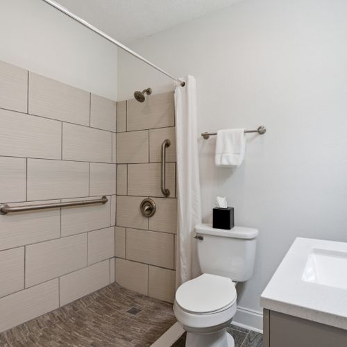Clean, bright bathroom w/ a fresh, airy feel