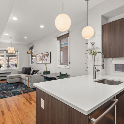 Bright quartz countertops set the tone for easy cooking and stylish meals