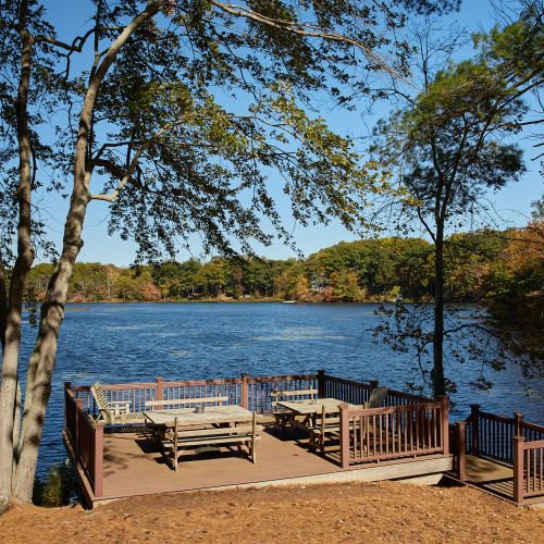 Private dock on the property with picnic tables for eating lakeside.