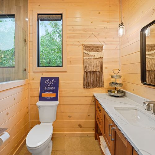 Perfectly situated just off the bunk room, this convenient full bathroom features crisp finishes and a spacious walk-in shower—ideal for keeping everyone upstairs refreshed and ready for adventure.