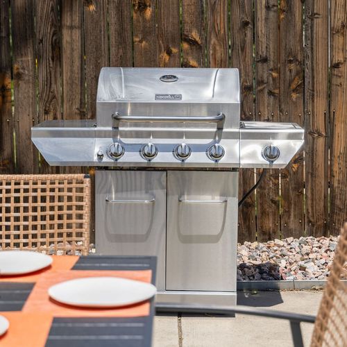 - make the most of your stay with a full size stainless grill ready for backyard bbq fun
- set just steps from the outdoor table, it's perfect for grilling up summer favorites
- surrounded by a privacy fence for peaceful and relaxed outdoor meals