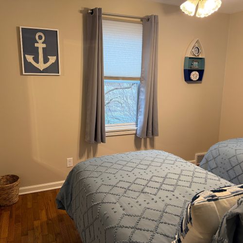 Bedroom #3:  features 2 matching twin beds, ceiling fan, closet, nightstand, and lamp