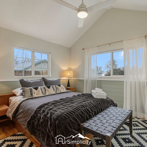 Settle into the secondary bedroom for a restful night of sleep on a plush queen-sized bed.