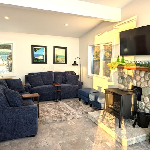 LIVING ROOM (UPPER LEVEL):  The home has an exquisite living room on the upper level (third floor) with a spectacular view of Crystal Lake!  PLEASE NOTE THAT THE FIREPLACE IS NOT AVAILABLE FOR GUEST USAGE.