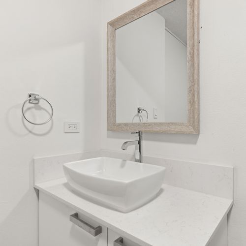 A beautifully designed bathroom with clean lines and a pristine basin.