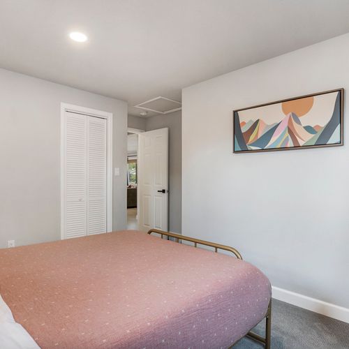 The ample-sized second bedroom offers comfortable space and stylish decor.
