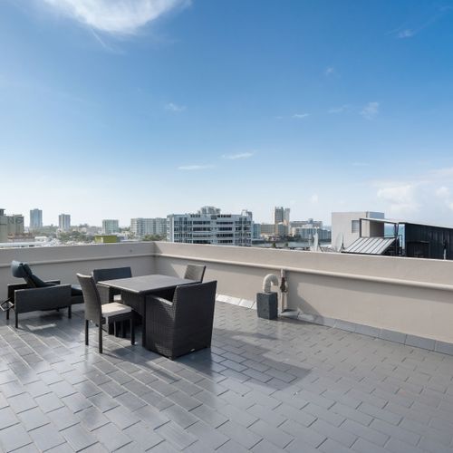 Sunbathe or relax in our stylish rooftop lounge.