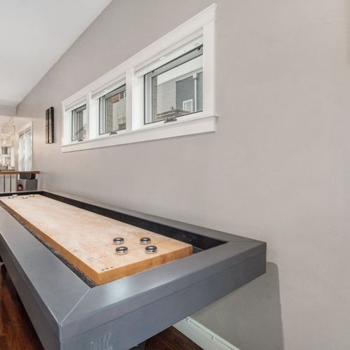 Challenge others to a game of shuffleboard.