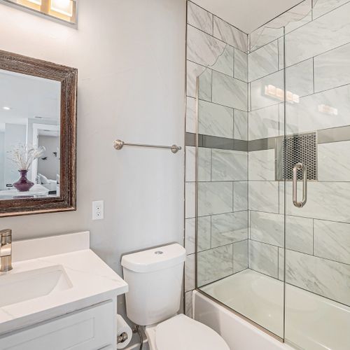 High-end finishes meet everyday functionality in this well-planned modern bath.