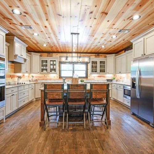The kitchen with updated appliances and additional seating.