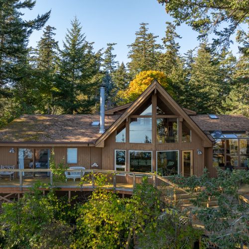 Environmentally conscious, the home was built around the large, magnificent trees on the property.