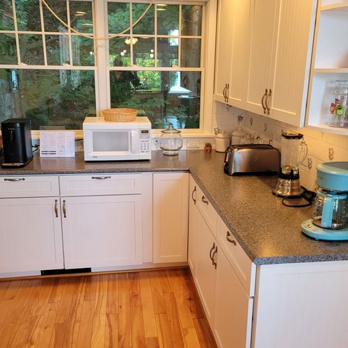 KITCHEN (SECOND FLOOR):  The home has a large kitchen with all appliances including a dishwasher.  Also includes a good supply of cooking and dining utensils.