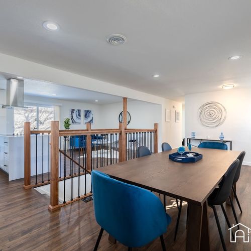 The stairwell leads down to the spacious basement, which includes two bedrooms, game room, and more living space.