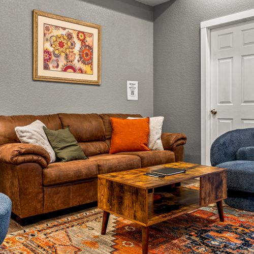 A cozy living room with soft seating and warm accents, creating the ideal space to relax.