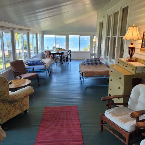 PORCH:  Part of the huge covered porch that includes 3 single beds and a great view of Crystal Lake
