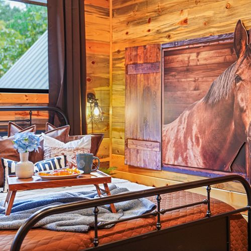 In this one-of-a-kind bedroom, you'll feel like you’ve stepped straight into a peaceful horse barn—minus the hay.