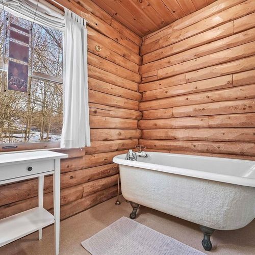 Bathroom #1 (main floor):  full bathroom with an antique tub.