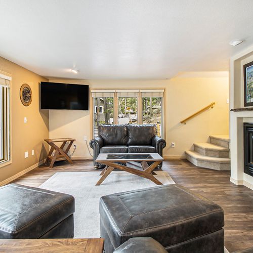 Open-layout living room designed for ultimate relaxation & nature views.
