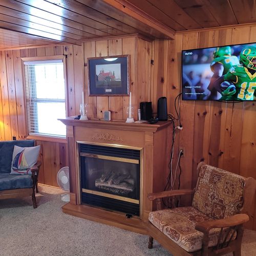 Living room:  very cozy and comfy living room with two sofas, two comfy chairs, a coffee table, and a gas fireplace.