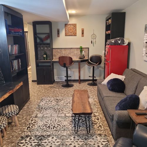 Living room #2 (first floor):  cute and stylish living room on the first floor. Includes a vintage beverage refrigerator and additional dining space.