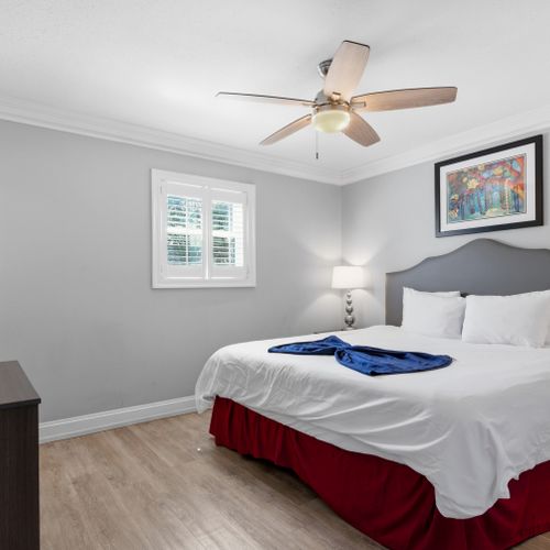 Wake up refreshed in a bright bedroom w/ soft natural light & crisp bedding.