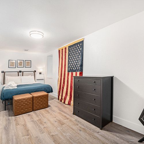 This cozy bedroom with a patriotic touch is the perfect place to relax and unwind.