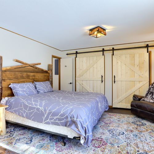 A comfortable king-size bed to retire to after an adventurous day.