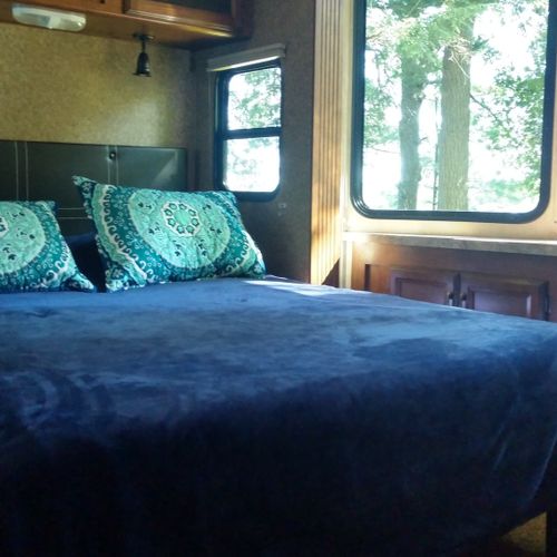 Bedroom #1:  features a queen-size bed, dresser, and a great view of little platte lake.