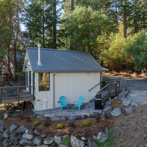 Enjoy your own outdoor patio with seating, a BBQ, and serene nature views.