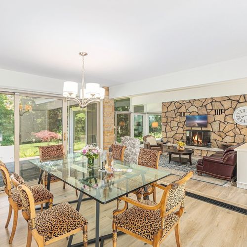 OVERVIEW:  The beautiful dining room and living room.