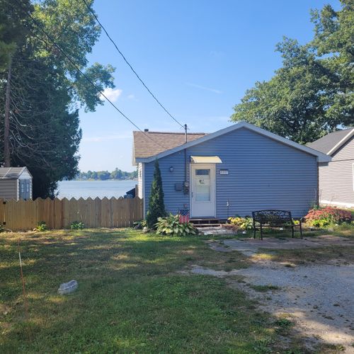 Exterior:  the front of the cottage in summer.