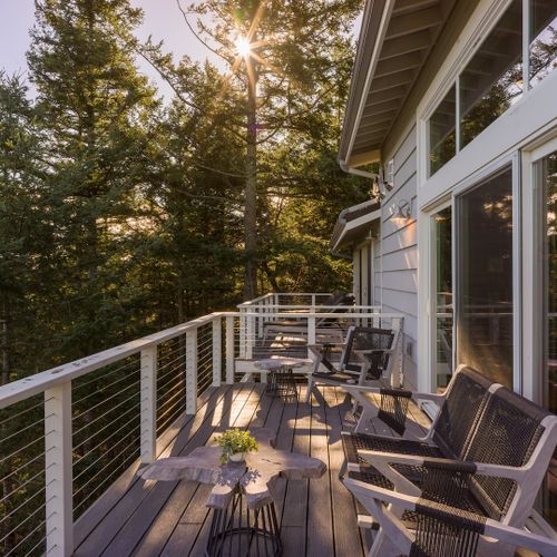 Teak outdoor furniture with water views of East Sound and surrounding mountains.