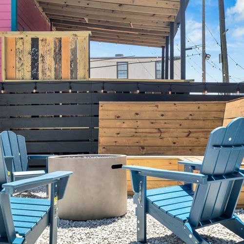 Lively patio w/ Adirondack chairs & a firepit — made for easy NOLA evenings.