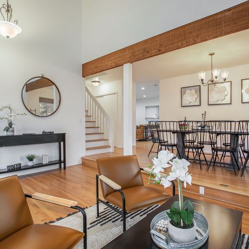 The open layout of this home's dining area and living room is perfect for entertaining and brings everyone together.