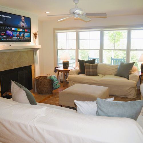 Overall:  the home has a very comfy living room with a wood fireplace and great views of the backyard, long lake, and sleeping bear dunes right from the living room.