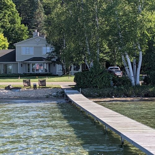Overview:  looking at the home and the gorgeous lakefront from out on the private dock.