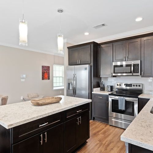 Sleek kitchen w/ stainless steel appliances & plenty of counter space to cook up a feast.