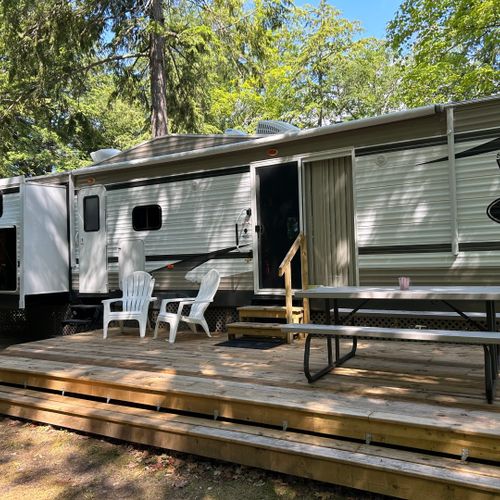 Exterior:  the front of the park home, highlighting the private deck.
