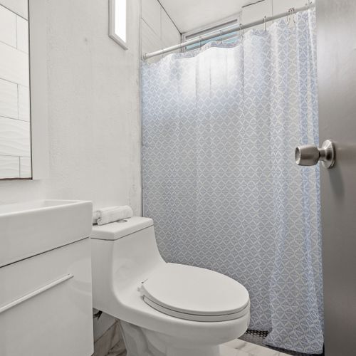 Spacious vanity and refreshing shower.