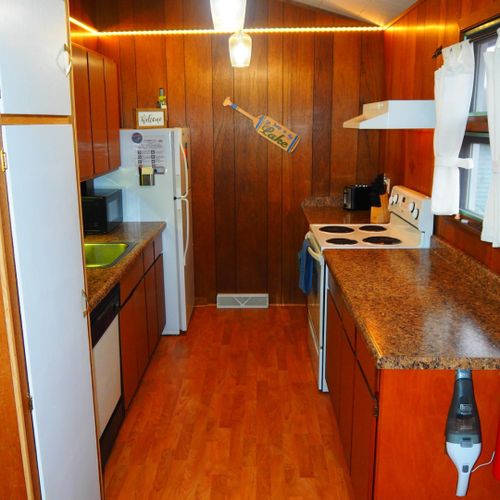 Kitchen:  very convenient and functional galley kitchen with all appliances, including a dishwasher. Includes lots of counter space and a good supply of cooking and dining utensils.