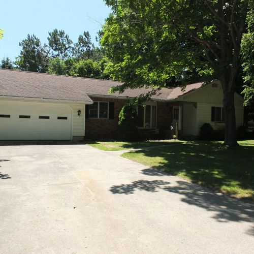 Exterior:  another view of the front of the house highlighting the driveway